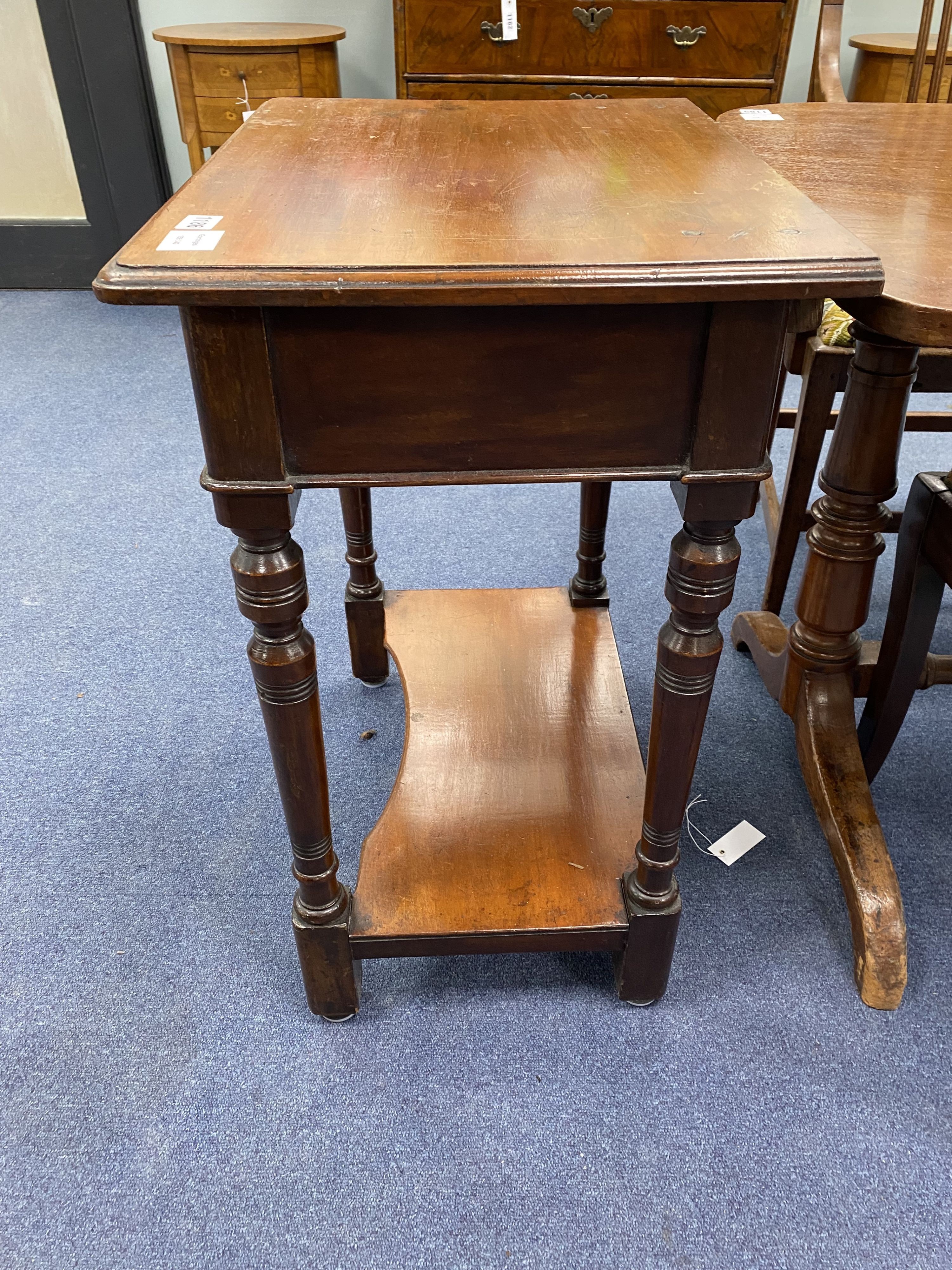 A small Victorian mahogany two tier side table, width 60cm, depth 43cm, height 72cm